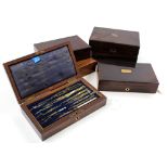 Six drawing sets, each in rosewood box, containing numerous compasses