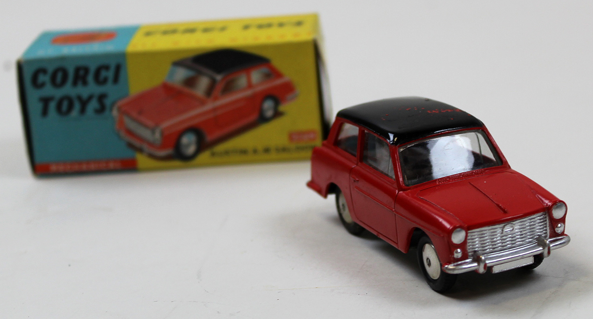 Corgi No.216 Mechanical Austin A40 Red & Black. Good with badly rubbed roof in Excellent blue &