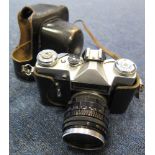 Vintage Zenit-E USSR 35mm SLR camera with Helios-44 2/58 lense fitted. Complete with leather case