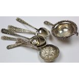 Eight pieces of American silverware and an unmarked silver tea strainer. 5 spoons are marked