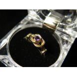 9ct Gold Love Knot Ring set with Amethyst size L weight 3.2 grams