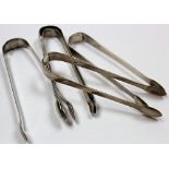 Five silver pairs of sugar tongs. Three pairs repaired and two pairs of Georgian plain old English