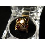 9ct Gold Ring set with central Opal surrounded by Garnets size L weight 6.6 grams