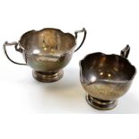 Silver sugar and creamer. Hallmarked with a maker that cannot be read. Sheffield 1930. Weight -