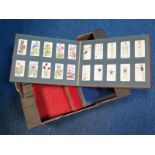 Collection of approx 19 complete sets & 4 part sets contained within 7 old slide in albums, better