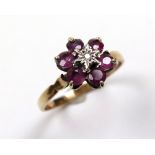 9ct Gold Ring floral set with Rubies and Diamond size R weight 2.5 grams