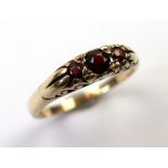 9ct Gold ring set with 3 Garnets size O weight 2.4 grams