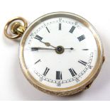 Ladies 14k open face pocket watch, white enamel face with black Roman numerals, weight 27 grams