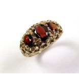 9ct Gold 3 stone Garnet Ring size K weight 3.9 grams