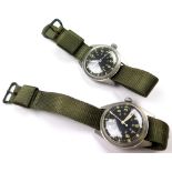 Two military stainless steel gentleman`s wristwatches, dated 1969 & 1971. The black dials with white