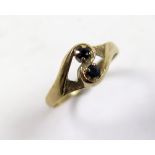 9ct Gold Ring set with 2 Sapphires figure of 8 size L weight 1.6 grams