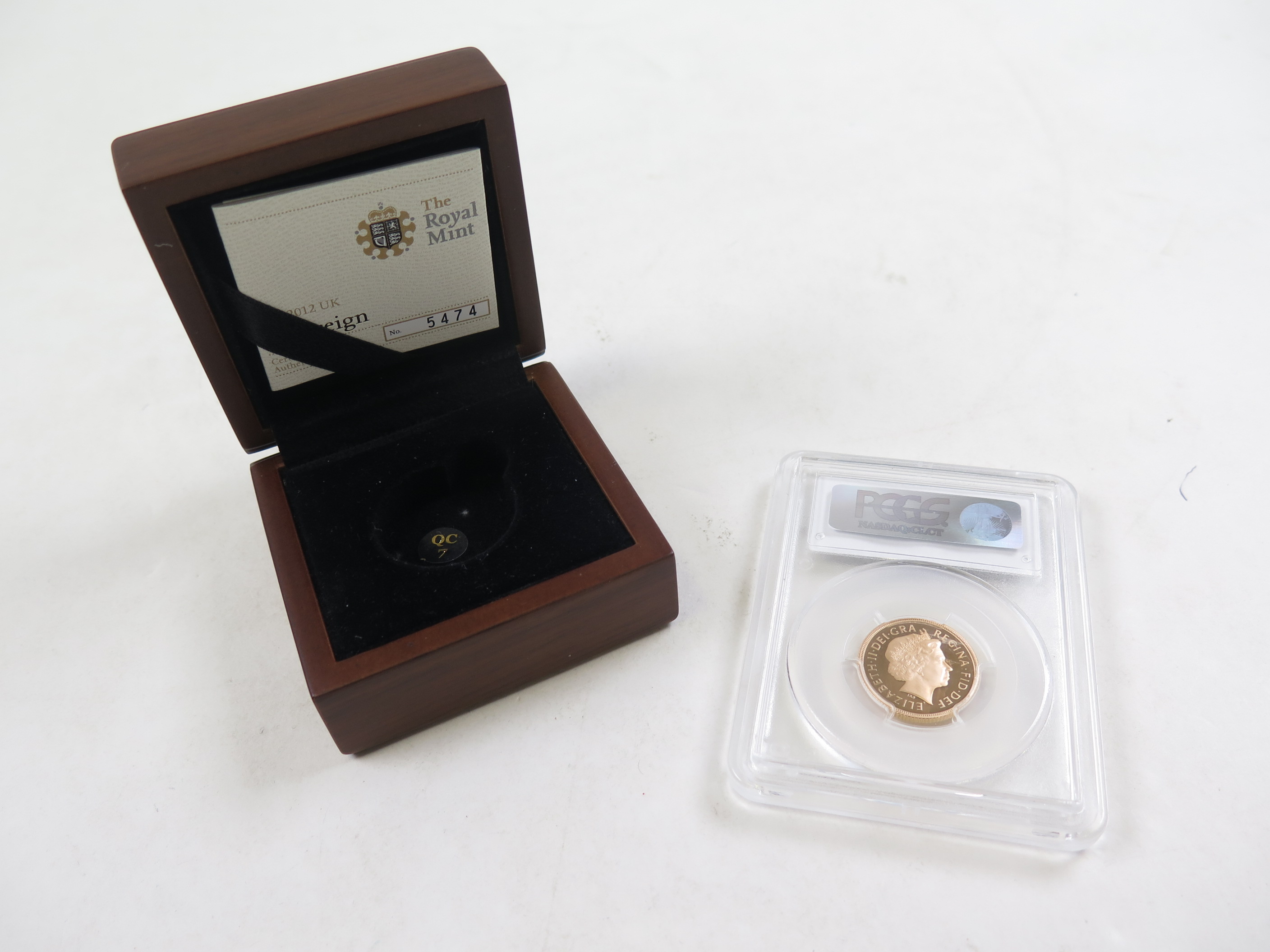 Sovereign 2012 PCGS slabbed as PR70DCAM along with its original box and certificate