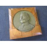 A large bronzed relief plaster cast of the Kaiser, professionally mounted in oak panels. An