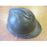 A Great War 'Adrian' Pattern Helmet shell lacking liner and RF Badge. Some wear