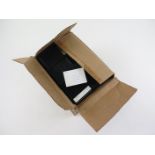 Box packed with various loose World stamps housed in small black plastic cases (qty) Buyer collects