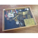 Display case containing a collection of medals and militaria. 32 items including 1914 Mary Gift Tin,