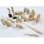 Collection of fourteen pre war ivory items, comprising six elephants, two rhinos, two figures, one