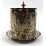 Victorian silver plated biscuit box of cylindrical form, engraved with foliage on a circular base