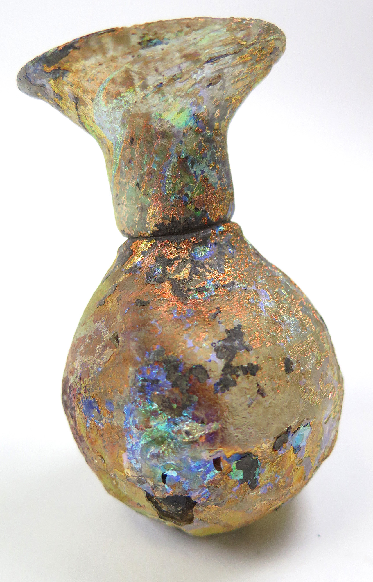 Roman 1st - 3rd Century glass bottle, with irridescent colour, 8cm high, 5.5cm wide