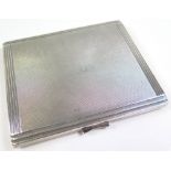 An Engine turned silver cigarette case. Hallmarked Birmingham 1932, by Mappin and Webb, total weight