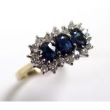 9ct Gold Ring set with 3 Sapphires surrounded by Diamonds size Q weight 3.0 grams