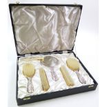 Ornate silver vanity set, hallmarked 'B&Co, Birmingham 1971', comprising four brushes, mirror and