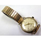 Baume 9ct gold cased gents wristwatch, the cream dial with gilt baton markers on a non gold