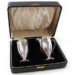 Silver milk jug and sugar sifter set, in original case, hallmarked 'Birmingham 1938', finial to