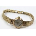 Ladies Omega wristwatch, circular dial with baton markers, 9ct gold case and bracelet, total