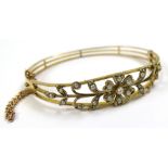 9ct Gold Hinged Bangle floral pattern set with Seed Pearls weight 10.1 grams