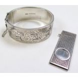 Modern Silver Cigar cutter (hallmarked Birmingham 1976) along with a silver bangle (hallmarked