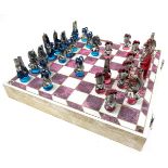 Large chess set with painted metal and coloured glass Medieval pieces, all contained in a case which