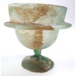Roman 1st - 3rd Century glass vessel, with a wide mouth raised on a bulbous body and twisted stem,