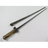 Bayonet: A WW1 French Model 1886/93/16 bayonet with brass hilt. Sound condition. Worn overall. In