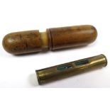 Miniature brass spirit level, contained in treen holder, level length 6.8cm approx.