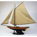 Wooden model yacht on stand, height 34 inches, length 30 inches