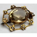 9ct Gold Ladies Brooch with Large oval central Citrine surrounded by seed pearls (one missing)