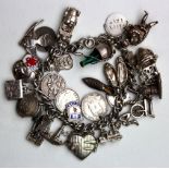 Silver Charm Bracelet with 30 approx charms weight 88.2 grams