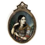 Portrait miniature. Hand painted portrait miniature of girl in traditional indian dress, circa
