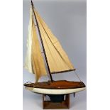 Painted wooden model yacht, circa early to mid 20th Century, on stand, height 46 inches approx.,