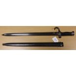 A French Model 1892 First Pattern bayonet for the M-1892 Berthier Carbine. Black composition