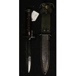 A WW2 U.S. M3 fighting knife in its US M8 scabbard made by B.M. Co. Leather washer grip. Rock Island