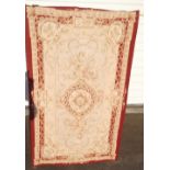 Textiles, an embroidered cream, beige & maroon rug, approx 120cm x 50cm (gen gd)