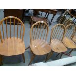 Set of four Blonde Ercol hoop and stick back dining chairs