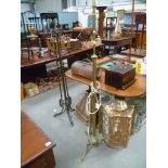 Edwardian brass telescopic standard lamp raised on three supports