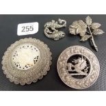Three white metal brooches, one Scottish, the other one of Jerusalem 935 silver with mother of