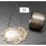 Edwardian silver 'BRANDY' spirit label, the rim case with fruiting vine, maker HA, Sheffield 1909;