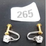 Pair of 18ct white and yellow gold claw set diamond screw back earrings, each diamond of 0.20 spread