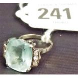 Art Deco style white metal pale blue stone and diamond ring, the large cushion cut stone flanked