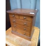 Victorian walnut apprentice chest of two short over two long drawers upon plinth base, width 11'